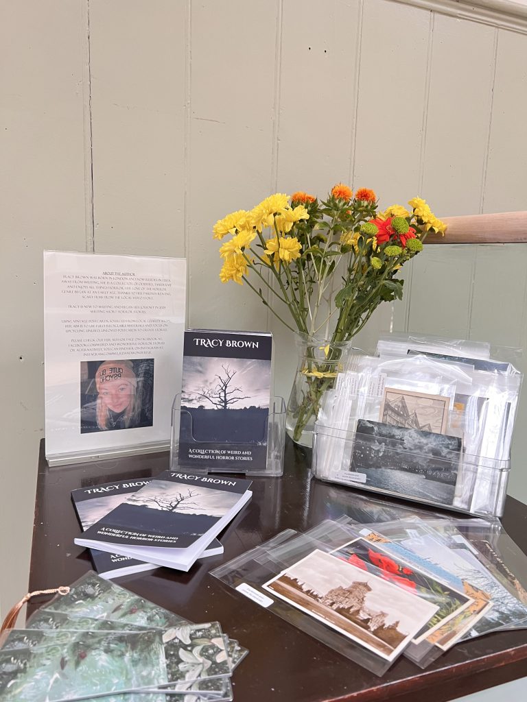 Flowers and leaflets on stand